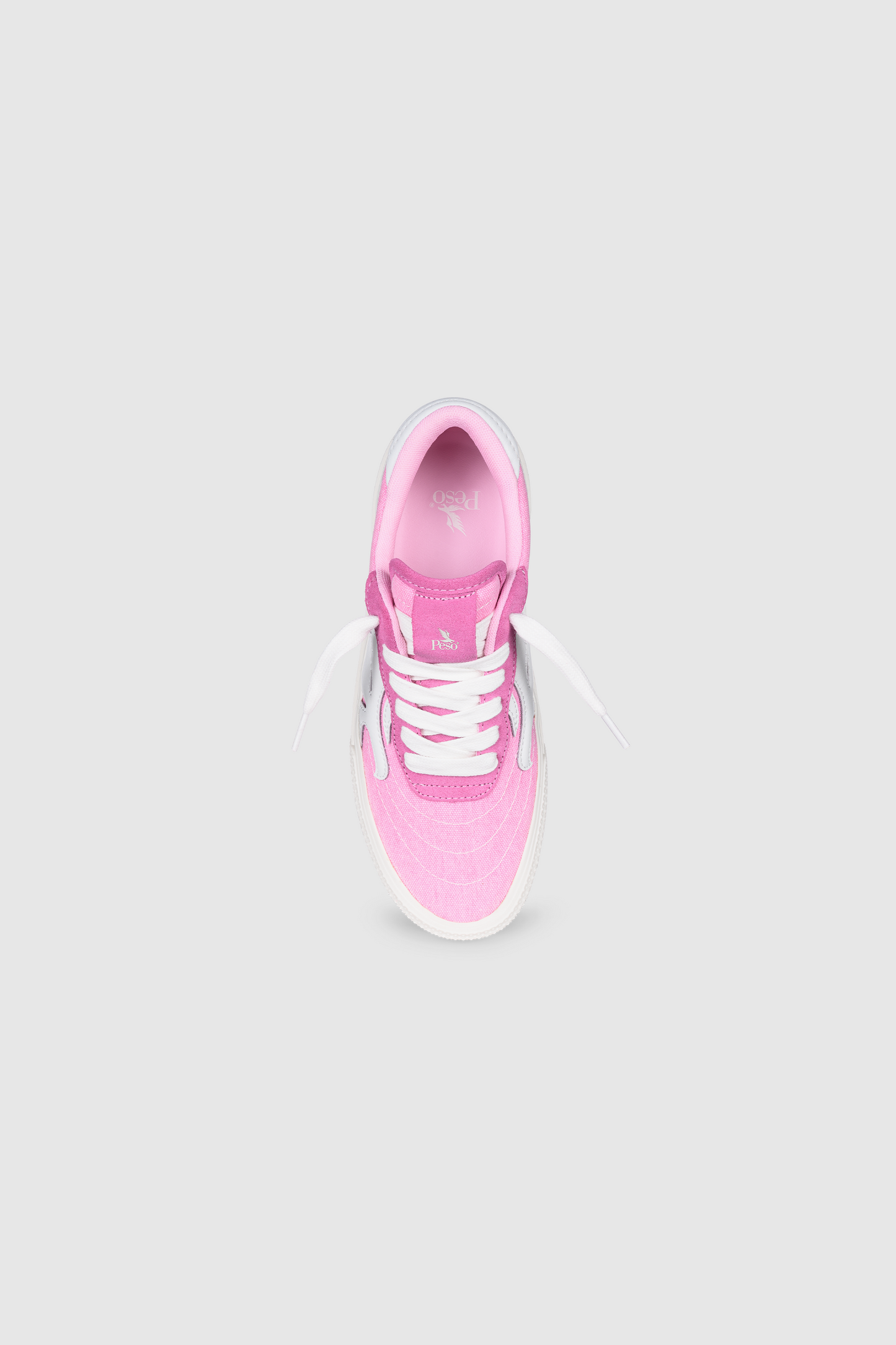 The PESOCLO Peso Skate is a pink sneaker featuring white laces and a white sole, crafted from a stylish canvas-suede mix and shown from above on a light gray background.