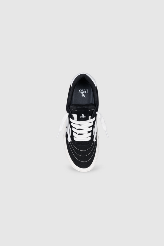 The PESOCLO Peso Skate sneaker is shown from above on a plain grey background, highlighting its black and white canvas-suede construction, white laces, white sole, and distinctive stitching around the toe. The PESOCLO brand logo is visible on the insole.